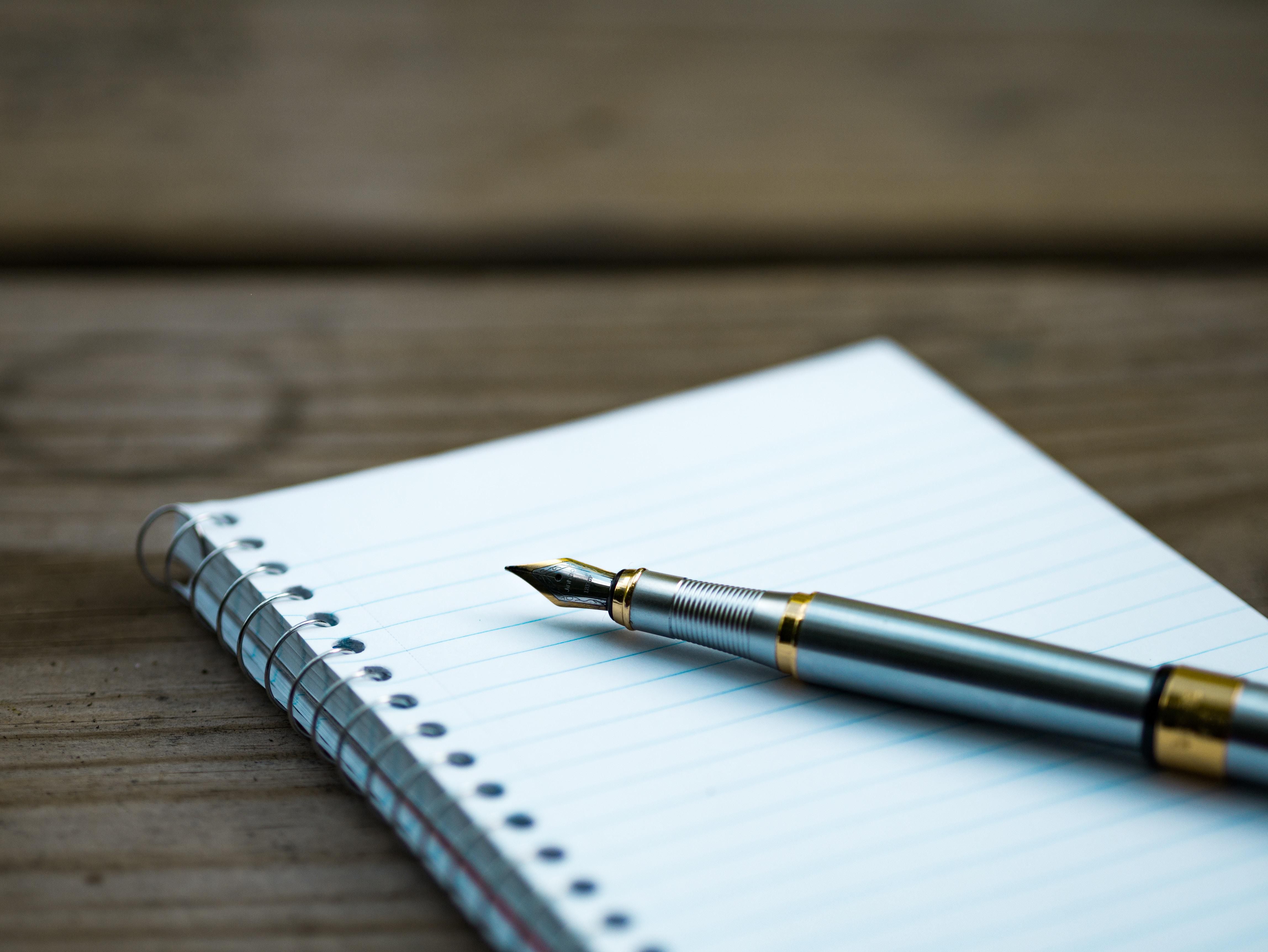 Photo of a pen and notepad